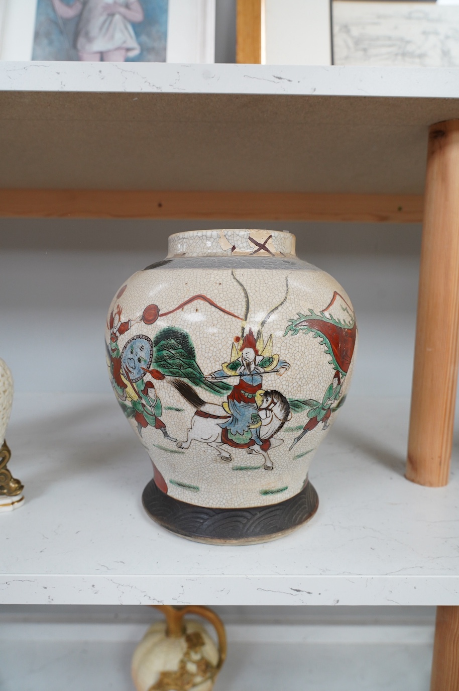 A Chinese crackle glazed famille verte vase, 24cm. Condition - poor